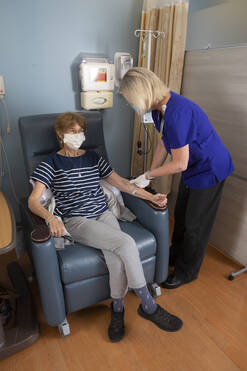 Infusion nurse with patient