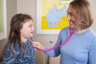 Pediatrics - Young girl patient with female provider listening to heart sounds