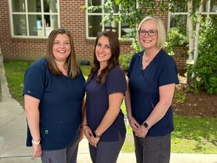 The NLH Infusion team stands outside smiling