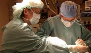 Two neurosurgeons in surgery