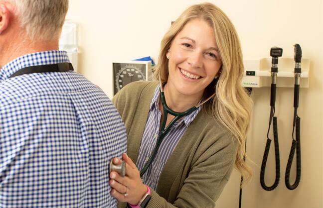 Express Care Plus provider listening to patients lung sounds